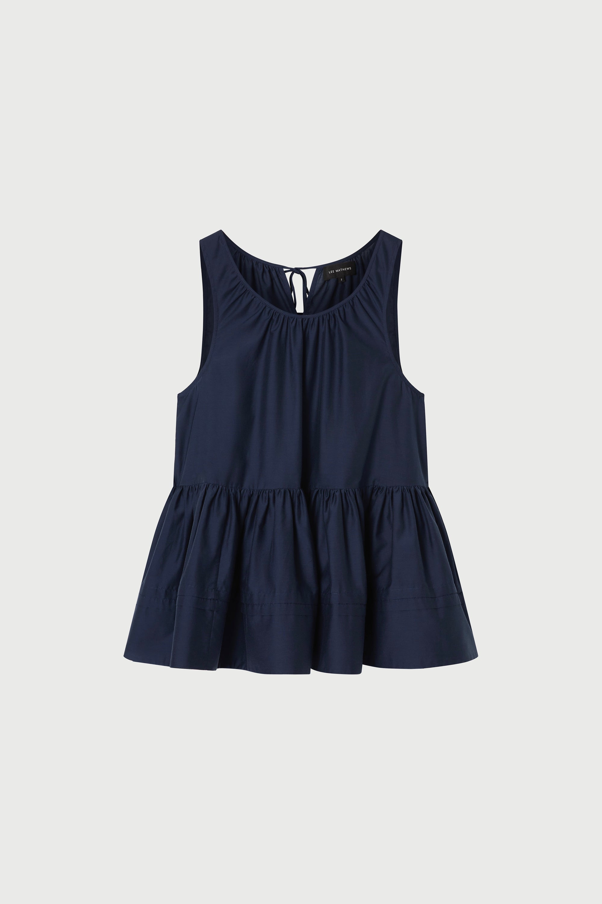 Navy blue blouse with a gathered detail  a white background