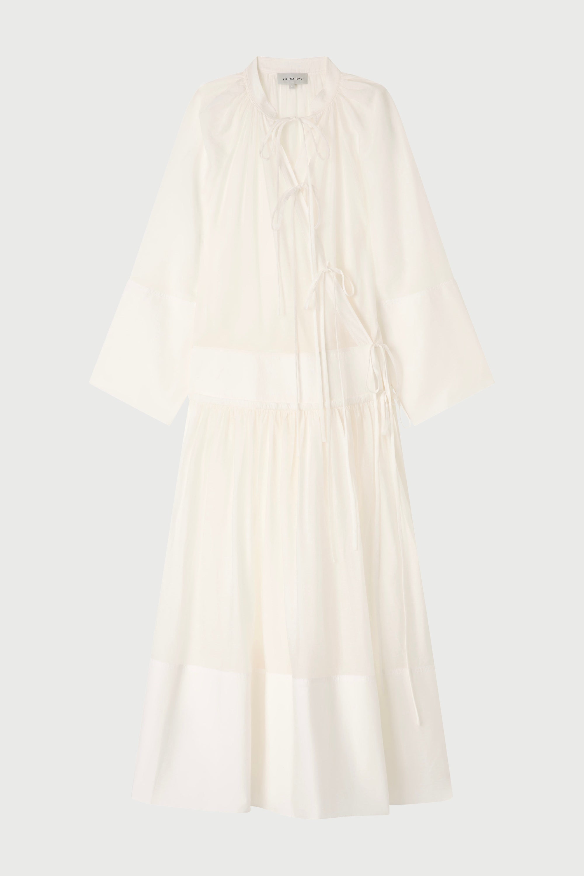 White sleeveless dress on a light gray background