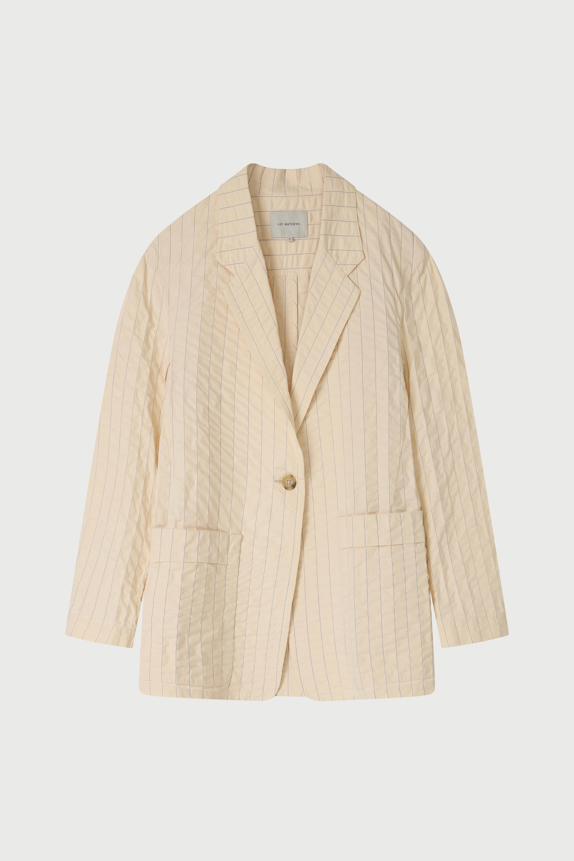 Beige blazer on a light gray background