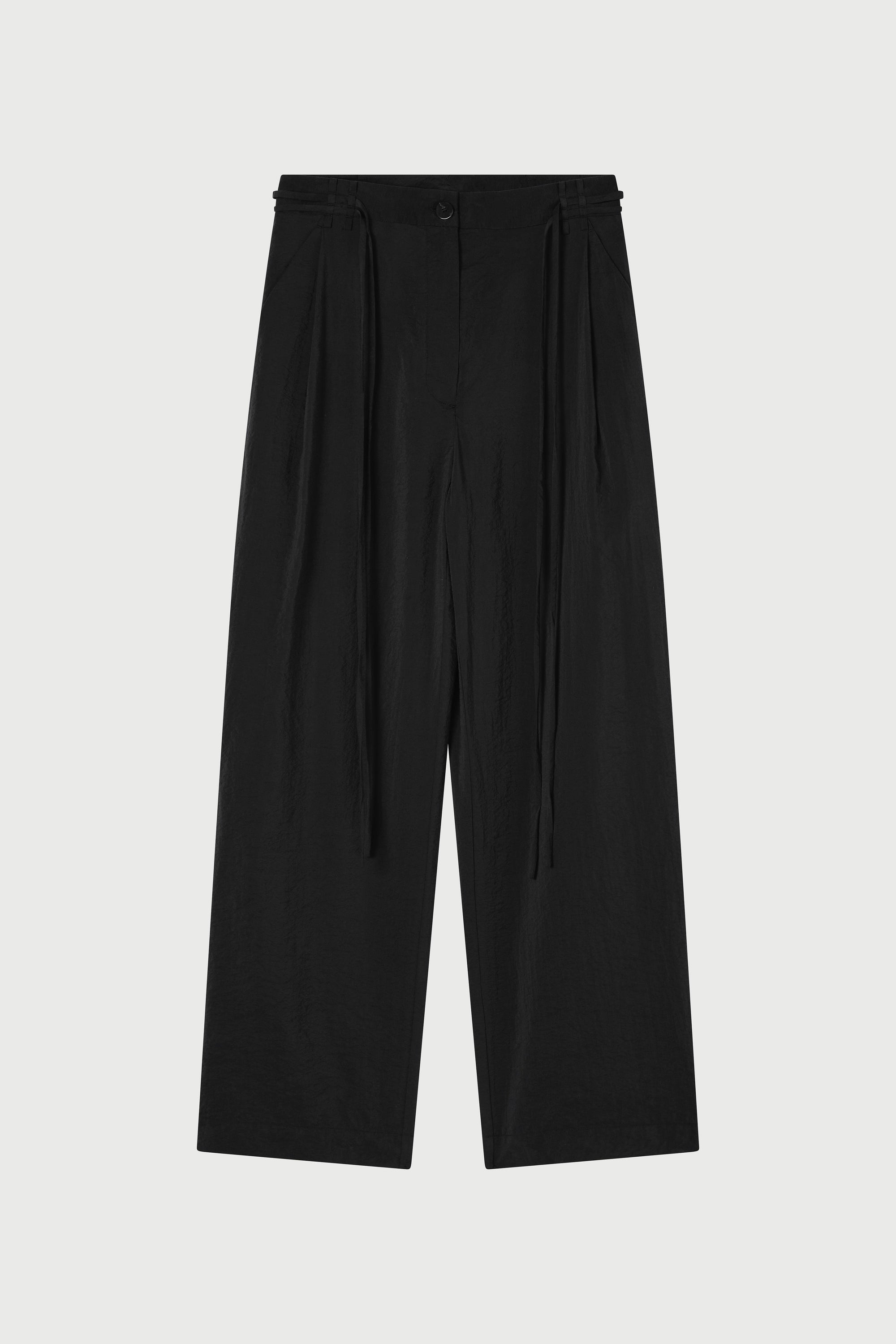 Black pants on a light gray background