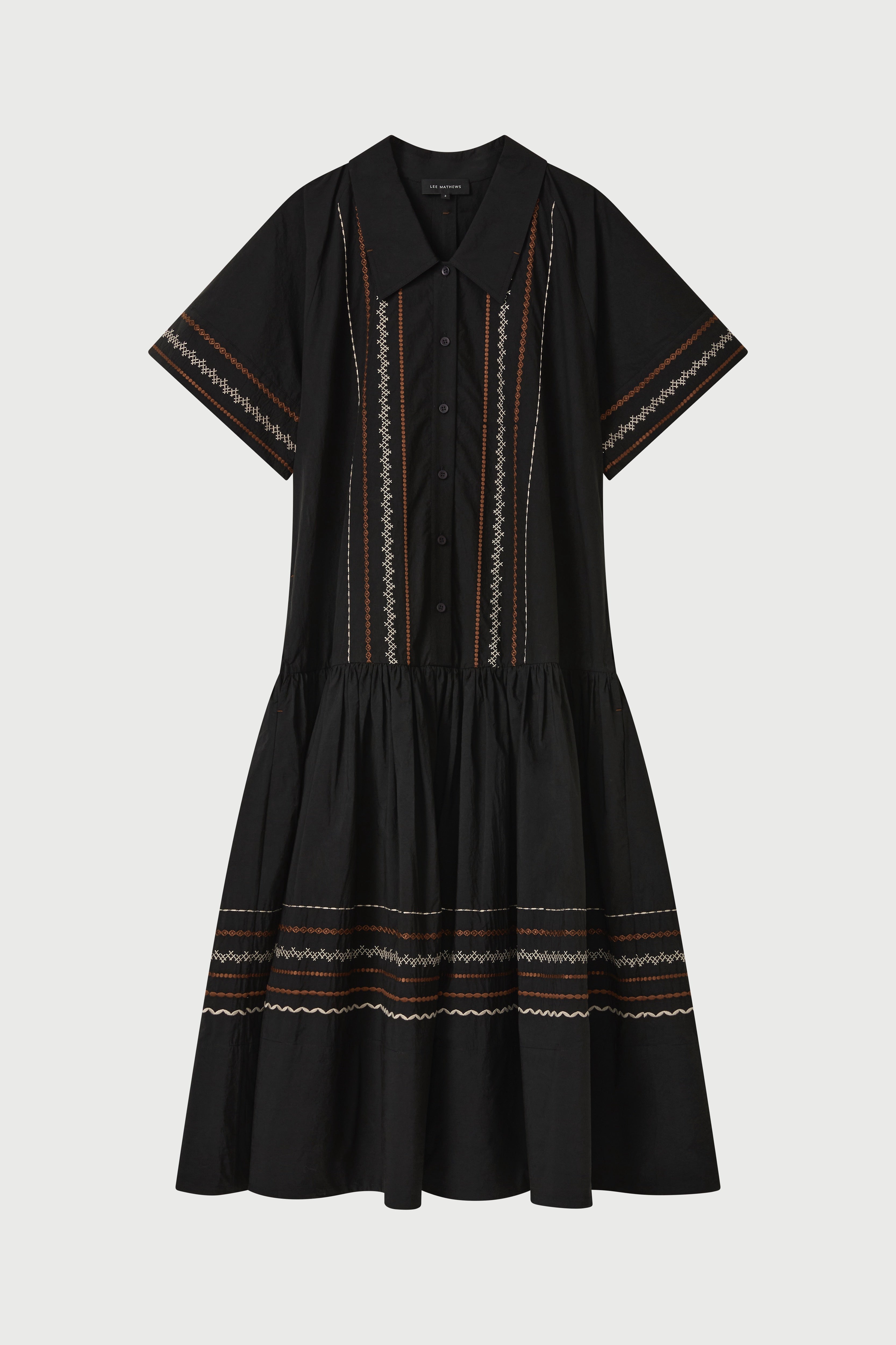 Black dress with intricate patterns on a white background