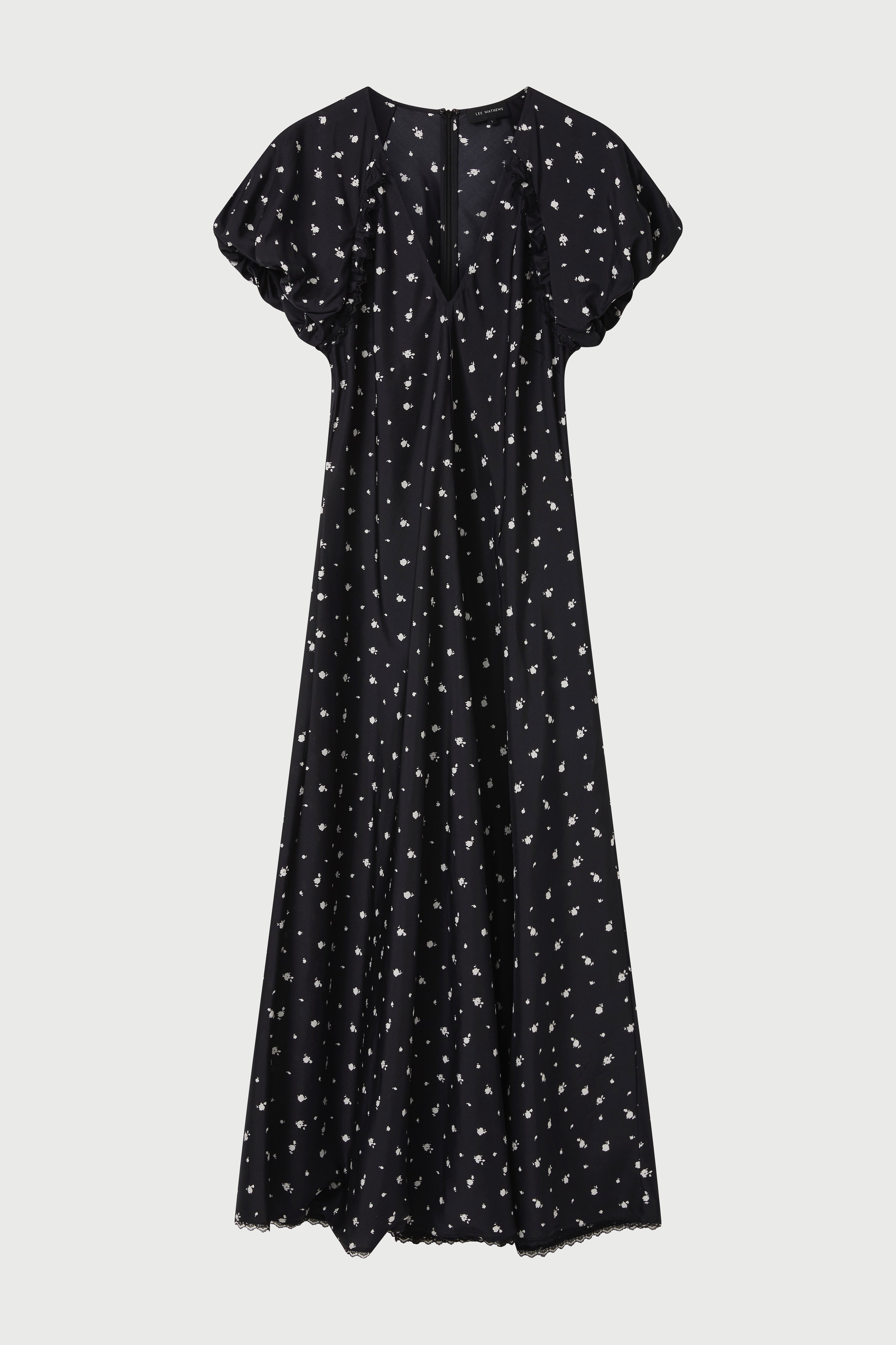 Black dress with white pattern on a light gray background